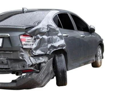 In raining day back side of  gray color car damaged and broken by accident on Stock Photos