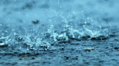 Raining droplets drop falling on ground of wet cements. Stock Footage 115693627
