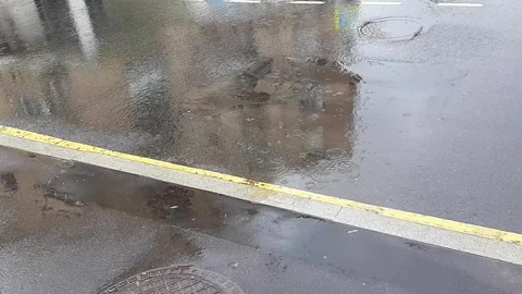 Raining. Empty wet city road. Close up. Stock Footage 135167313