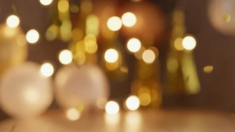 Raining glitter in front of blurred new years background Stock Footage 135107952