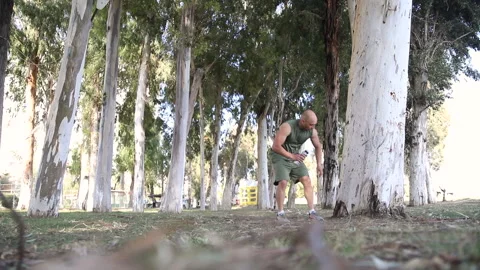 Raining man taking a break, outdoors among the forest Stock Footage 238667501