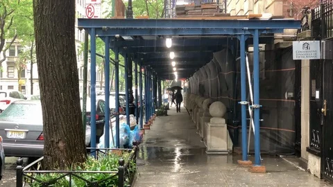 Raining man walking in distance umbrella raining in Manhattan New York City NYC 스톡 동영상 108198745