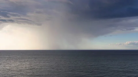 Raining on one spot on the ocean Видео 130881313