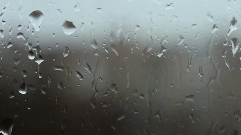 Raining outside, and close up rain drops in the glass. Stock-Footage 73597274