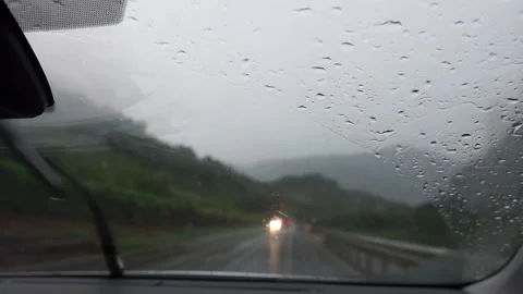 Raining outside, from inside a car Stock Footage 138235700