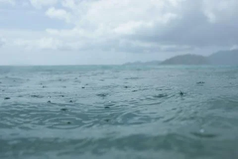 Raining over the sea Stock Photos