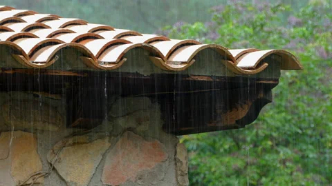 Raining over tile roof.Audio available Stock Footage 118158940