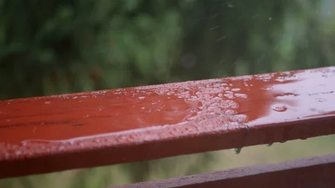 Raining on a piece of railing outside the window Stock Footage 94148192