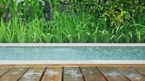 Raining Pool Tropical Dolly Slowmotion Stock Footage 70731772
