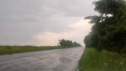Raining on rural countryside empty road, moody Stock Footage 252929552