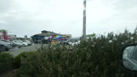 Raining Side Window POV, New Brighton, Marine Parade, Christchurch, New Zealand Video stock 146199867