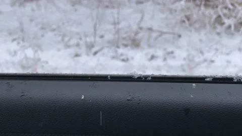 Raining / Snowing outside as Car window rolls down Vídeos de archivo 150877164