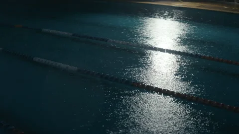 Raining on a swimming pool at night Stock Footage 169201666
