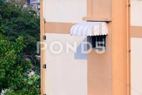 Rainproof awning of slide window on sunny day. Stock Photos