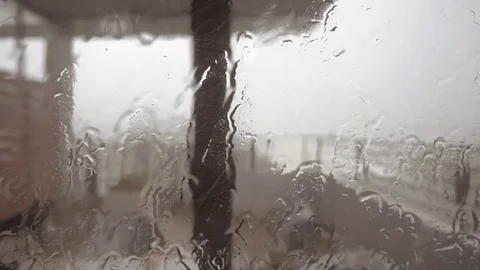 RainRain is falling heavily to the window glass in a lonely atmosphere. Video stock 75679019