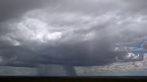 Rainstorm advancing over desert, time lapse Stock Footage 81195301