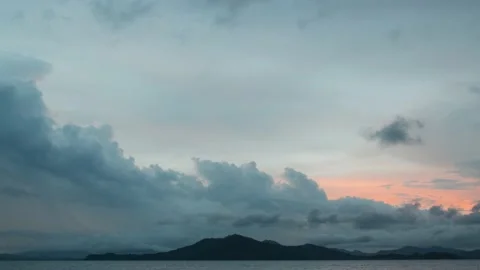 A rainstorm cloud was forming behind the mountain as the golden time sunset Video stock 205256069