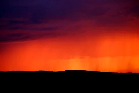 Rainstorm in Evening Sunset Light Stock Photos