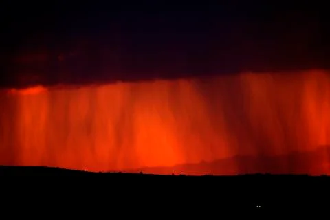 Rainstorm in Evening Sunset Light Stock Photos