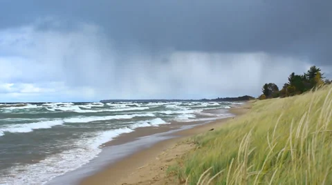 Rainstorm moving in over beach Stock Footage 34307686
