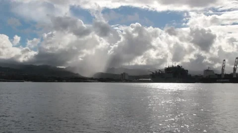 Rainstorm over Honolulu seen from the USS Arizona Memorial Video stock 67906019