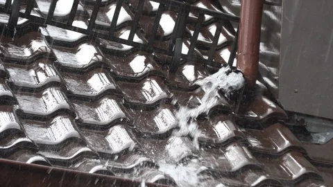 Rainwater beats from the drainpipe Stock Footage 94131581