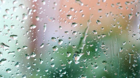 Rainwater on the car window is removed by the wipers Stock Footage 113066041