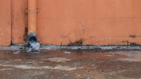 Rainwater comes out of the gutter Stock Footage 291554354