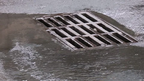 Rainwater is drained into an open storm system Video stock 288709975