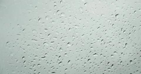 Rainwater drops Falling Down On the Window Glass, Rain Drops On The Windows Stock Footage 205041051