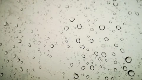 Rainwater drops Falling Down On the Window Glass, Rain Drops On The Windows.. Stock Footage 245127886