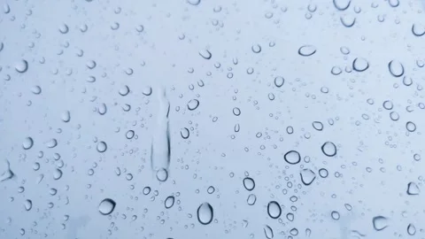 Rainwater drops Falling Down On the Window Glass, Rain Drops On The Windows.. Video stock 245127964
