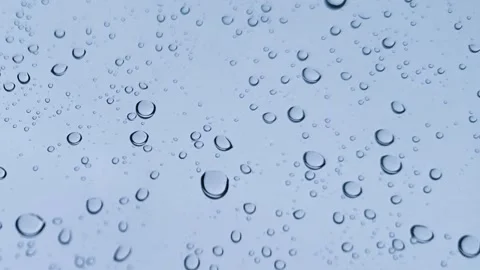 Rainwater drops Falling Down On the Window Glass, Rain Drops On The Windows.. Stock Footage 245127991