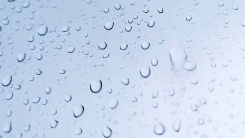 Rainwater drops Falling Down On the Window Glass, Rain Drops On The Windows.. Stock Footage 245128272