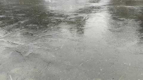 Rainwater drops falling on gray asphalt. Stock Footage 162241882