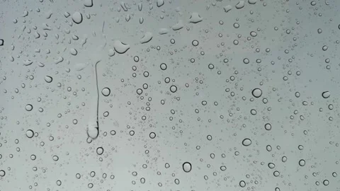 Rainwater drops Falling On the Window Glass, Rain Drops On The Windows Glass, Video stock 137175807