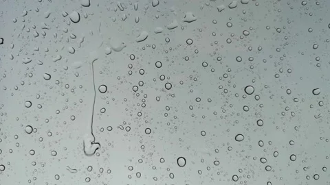 Rainwater drops Falling On the Window Glass, Rain Drops On The Windows Glass, Video stock 137176265
