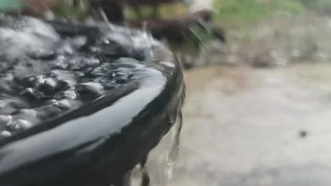 Rainwater falls into the bucket Video stock 234376583
