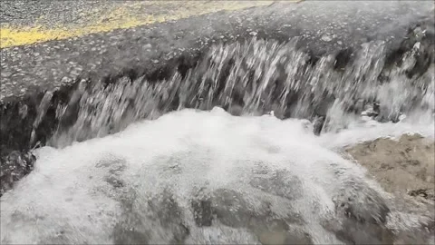 Rainwater flow on the road like a waterfall Stock Footage 315291067