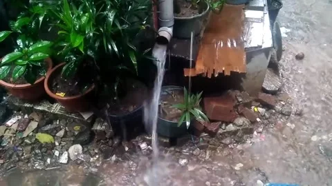 Rainwater flowing from the pipe Stock Footage 221482910