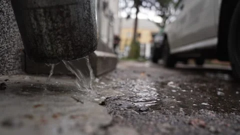 Rainwater flows from chrome drain pipe close-up. Stock Footage 331933396