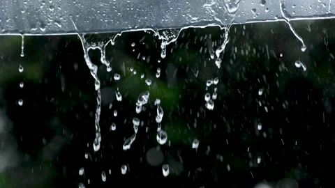 Rainwater flows down to the clear plastic awning on rainy days Stock Footage 145867709