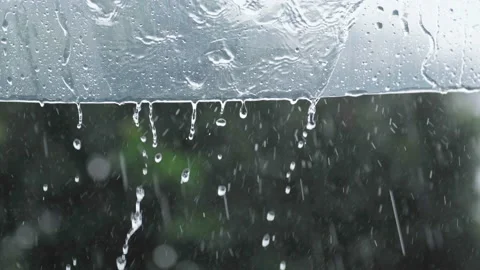 Rainwater flows down to the clear plastic awning on rainy days Stock Footage 145867796