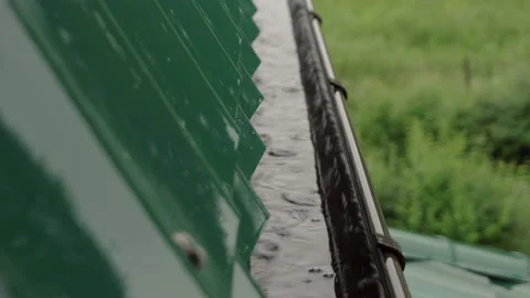 Rainwater flows down from the roof 動画素材 155793373