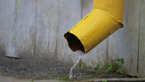Rainwater flows out of building drain pipe Video stock 165111541