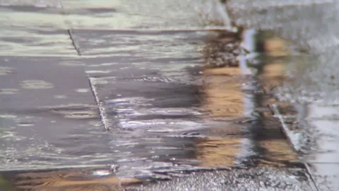 Rainwater pooling on the cement floor Stock Footage 257174956
