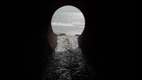 Rainwater Rushing through Drainage Pipe to Malibu Beach, California Stock Footage 240287532