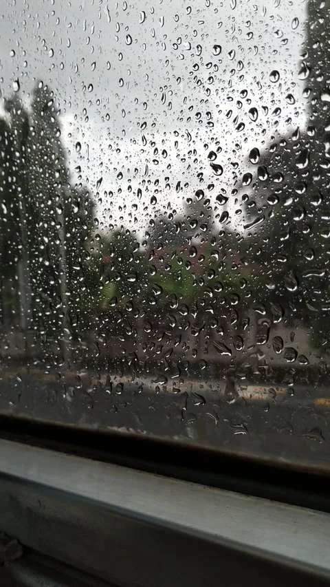 Rainwater splashes from outside the window Stock Footage 307789981