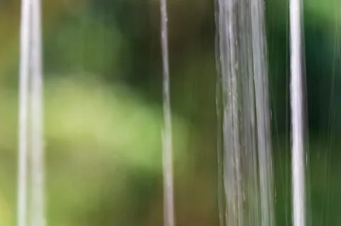 Rainwater Streaming Down a Windowpane. Stock Photos