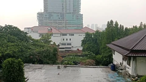 Rainy atmosphere during the day in the middle of Jakarta city Stock Footage 319992222